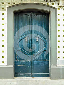 An ancient weathered stylish old wooden door