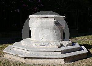 Ancient well made of stone in the city square