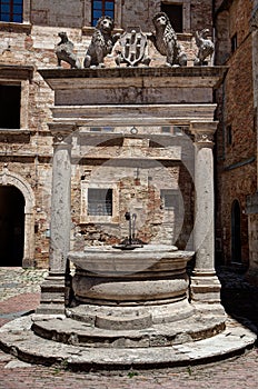 Ancient well Piazza Grande square, Montepulciano, Tuscany, Italy