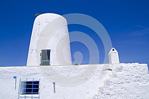 Ancient white salt windmill mill in Formentera