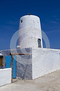 Ancient white salt windmill mill in Formentera