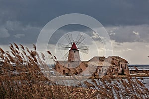 Ancient windmill in the salt pans of Marsala Sicily