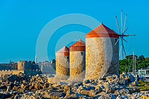 Ancient windmills at the port of Rhodes, Greece