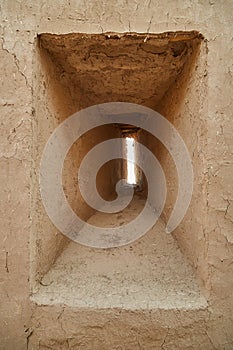 Ancient Windows loopholes in the walls of clay in the ancient castle of the Parthian city