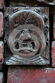 Ancient wood architecture and antique art wooden carved nepalese angel deity god in old ruins building for nepali people foreign