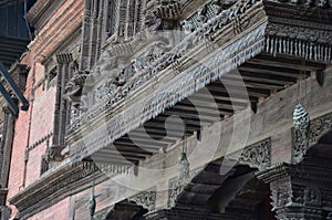 Ancient wood architecture and antique art wooden carved nepalese angel deity god in old ruins building for nepali people foreign