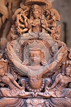 Ancient wooden bas-relief with Hindu God Garuda at Palace on Durbar Square in Patan, Nepal