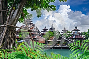 Ancient wooden building with a colorful old zinc roof in Sakon Nakhon Province, Thailand