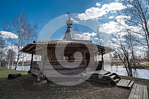 Ancient wooden chapel stands on the banks of the river