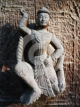 Ancient wooden crave at Golden Palace monastery in Mandalay, Myanmar