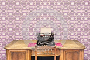 Ancient wooden desk with vintage typewriter in front of seventies purple wallpaper