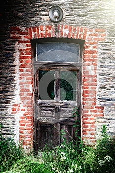 Ancient wooden door in abandoned house