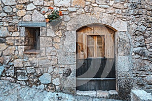 Ancient wooden door of a house in Siurana, Spain