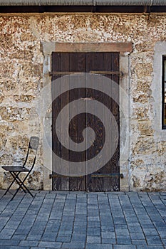 Ancient wooden door in stone castle wall. israel