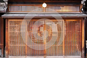 Ancient wooden doors of small Japanese restaurant