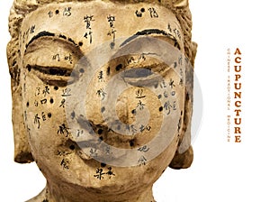 Ancient wooden female face showing acupuncture points,