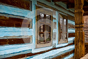 Ancient wooden house with beautiful old windows