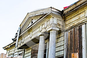 Old wooden manor , the ruins of ancient architecture. old ruined wooden house.