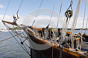 Ancient wooden sailboat pulleys and ropes