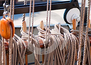 Ancient wooden sailboat pulleys and ropes detail