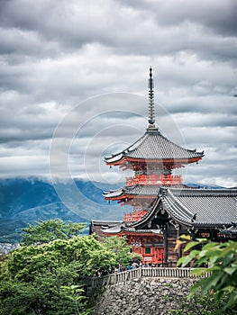 Ancient wooden temple with spring foliage colors at the mountain of Arashiyama, Kyoto, Japan