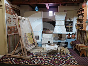 Ancient wooden vintage loom producing carpet