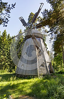 Ancient wooden windmill in forest