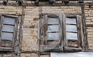 Ancient wooden window with the old brick wall exterior home architecture retro decoration at old town Kashmir, India. Antique