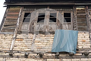 Ancient wooden window with the old brick wall exterior home architecture retro decoration at old town Kashmir, India. Antique