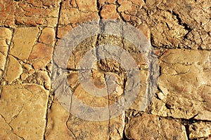 Ancient worn stone sidewalk polished by feet of people in Old City of Jerusalem, Israel