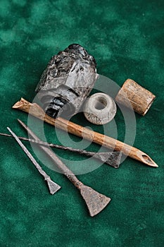 Ancient writing. Iron and bone stylos. Birch bark manuscript, clay spindle whorl, ancient bone product