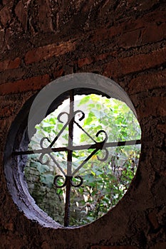 Ancient wrought iron round window