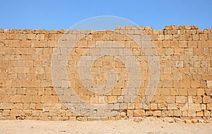 Ancient yellow stone wall texture