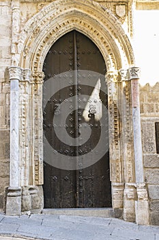 Anciente door, majestic facade of the cathedral of Toledo in Spa