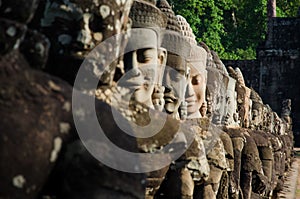 Ancients faces stone temple in ruins photo