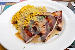 Andalusian cuisine, spicy cous-cous with grilled pork ham filet