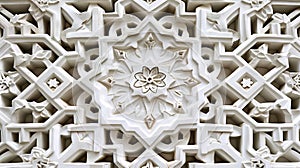 Andalusian plasterwork pattern with geometric motifs and intricate carvings