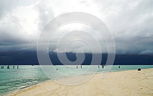 Andaman Sea before a thunderstorm. Koh Lipe Sunrise beach It`s starting to rain. There are large and dark storm clouds in the sky