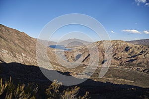 Andean afternoon scenery in Mendoza, Argentina: river, mountains and shadows