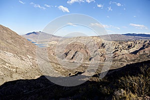 Andean afternoon scenery in Mendoza, Argentina: river, mountains and shadows