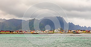 Andenes village panorama with multiple houses and mountains in the background, Lofoten islands, Andoy Municipality, Vesteralen