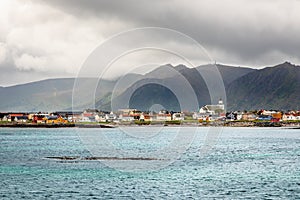 Andenes village panorama with multiple houses and mountains in the background, Lofoten islands, Andoy Municipality, Vesteralen