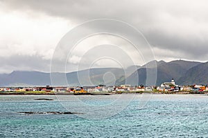 Andenes village panorama with multiple houses and mountains in the background, Lofoten islands, Andoy Municipality, Vesteralen