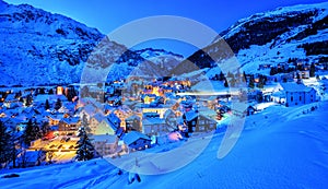 Andermatt village in Alps mountains in winter snow, Uri, Switzerland photo