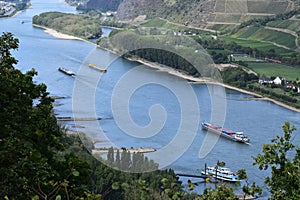 Andernach, Germany - 08 27 2020: cargo and fluid transport ships pass a passenger ship at the Geysir bridge