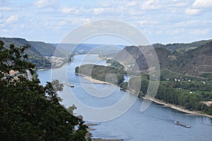 Andernach, Germany - 08 27 2020: Rhine between the islands near Namedy and Hammerstein with cargo ships
