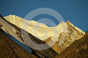 Andes snow covered mountain at sunset light