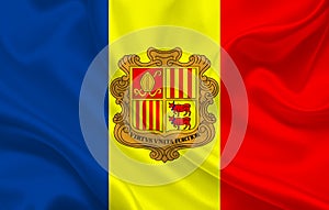 Andorra country flag on wavy silk fabric background