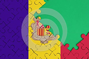 Andorra flag is depicted on a completed jigsaw puzzle with free green copy space on the right side