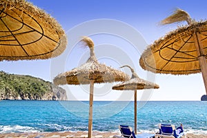 Andratx Port de Mar beach with sunroof umbrellas photo